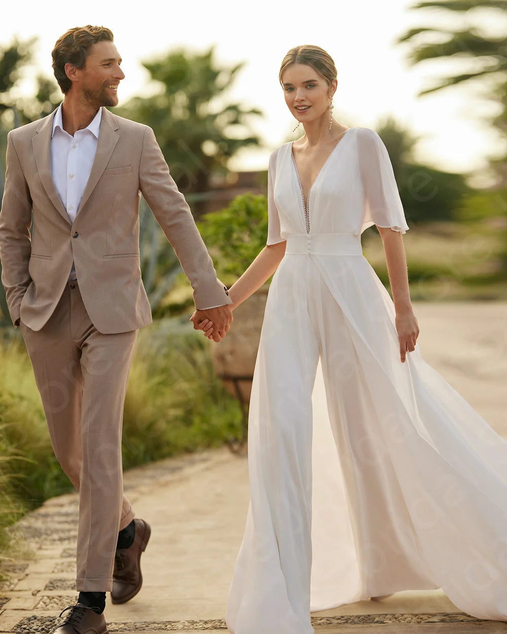 Wedding Jumpsuit With Removable Chiffon Train,  Elevate your bridal look with our White Two Pieces Wedding V Neckline Pant Suit. This modern boho jumpsuit features a deep V
