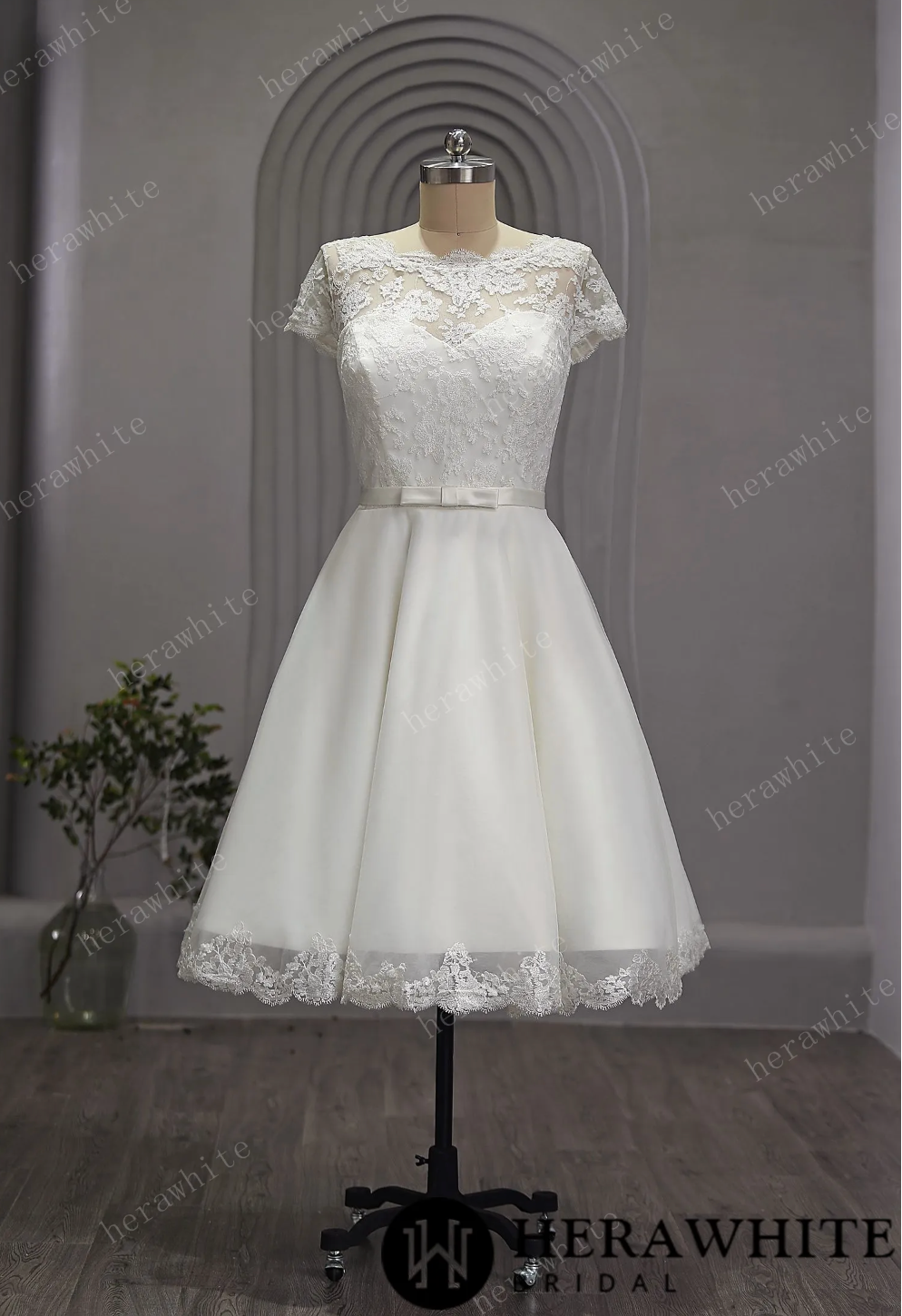 Mini Short Wedding Dress Tulle Lace Cap Sleeves, The length of the dress falls just below the knee, creating a chic and modern silhouette.