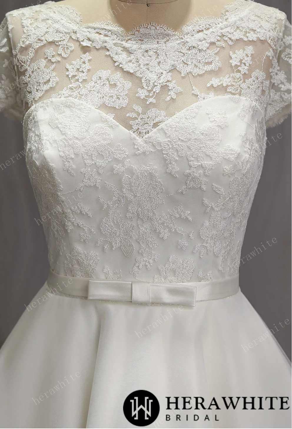 Mini Short Wedding Dress Tulle Lace Cap Sleeves, The length of the dress falls just below the knee, creating a chic and modern silhouette.