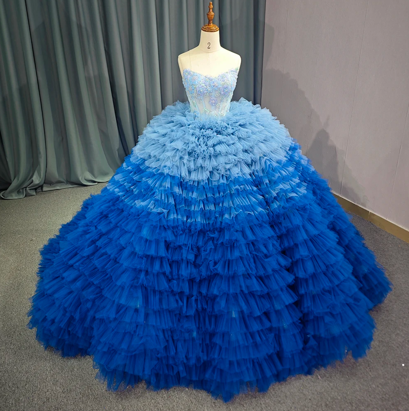 Quinceanera Dress Blue Tulle Ball Gown With Train, Indulge in the luxurious elegance of our Blue Ruffle Quinceanera Dress. The unique ombre design