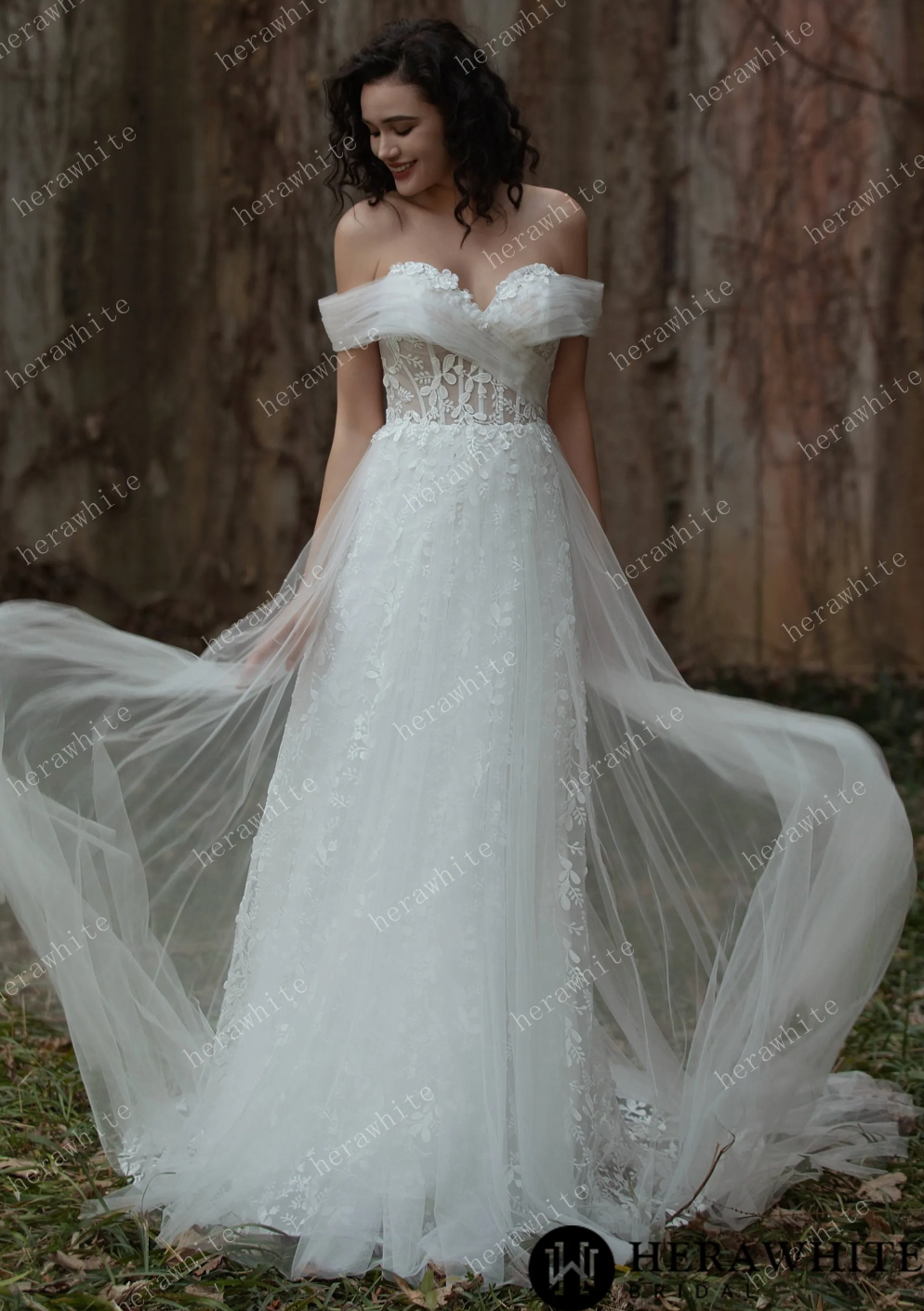 Sweetheart A-line lace bridal gown with off-shoulder design and flowing tulle skirt, capturing a magical bridal look.