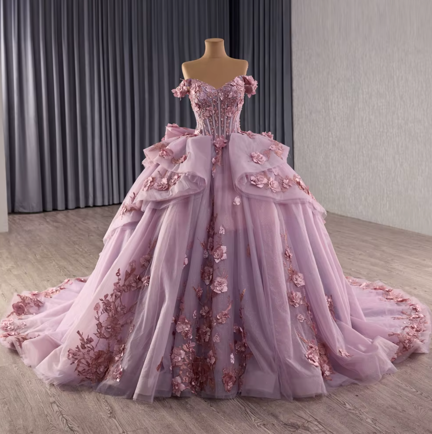 Lilac purple off shoulder quinceanera dress with ruffles and floral embellishments, perfect for special occasions.