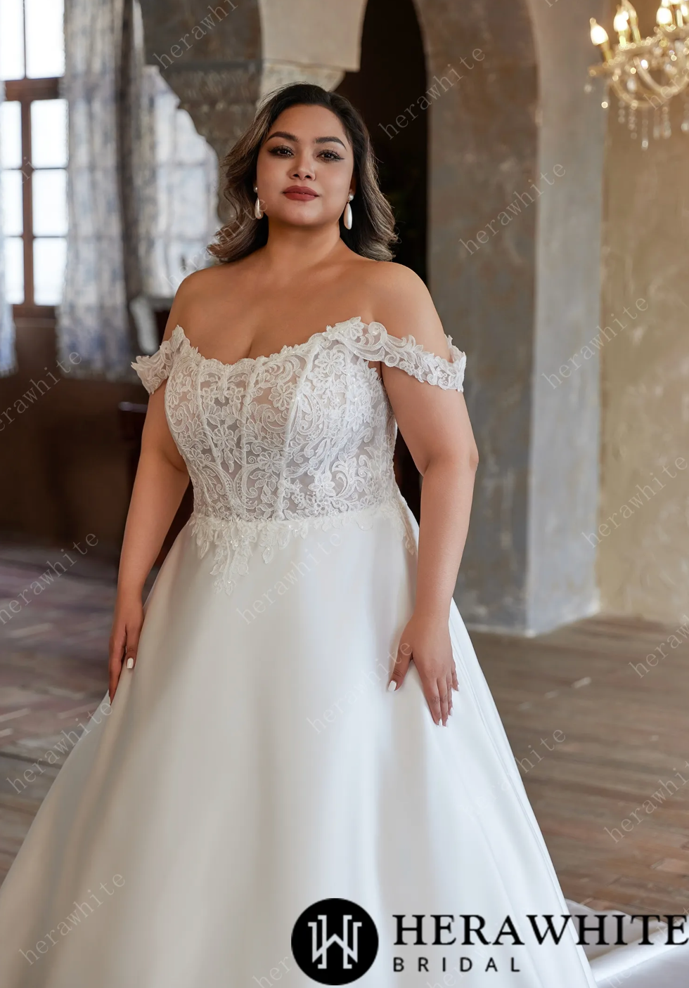 Vestido de novia moderno y glamoroso con hombros descubiertos