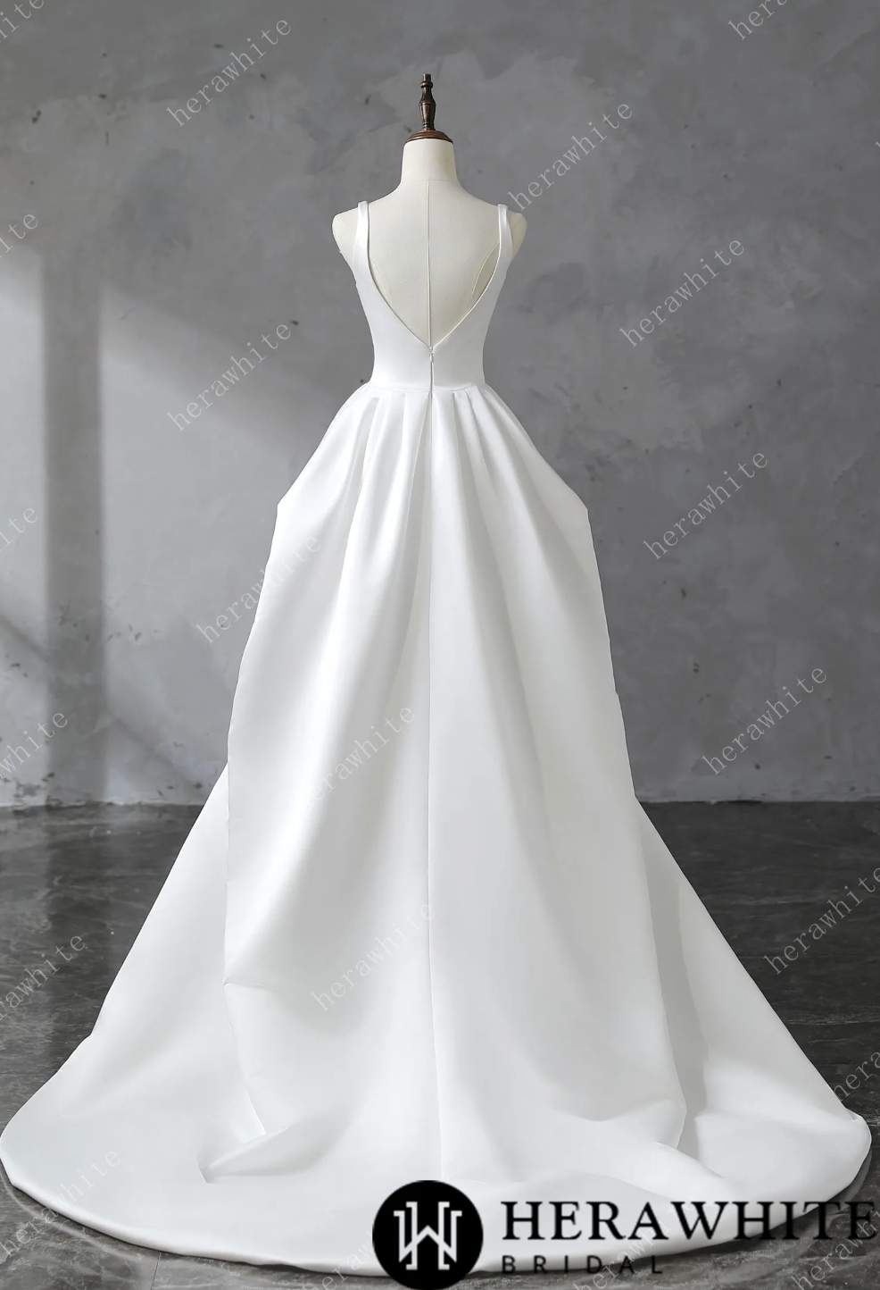 Wedding Dress Draped Satin Bridal Gown with Train, and straps and a deep U neckline, it highlights the décolletage gracefully. The skirt’s rectangular pattern, gathered at the waist,