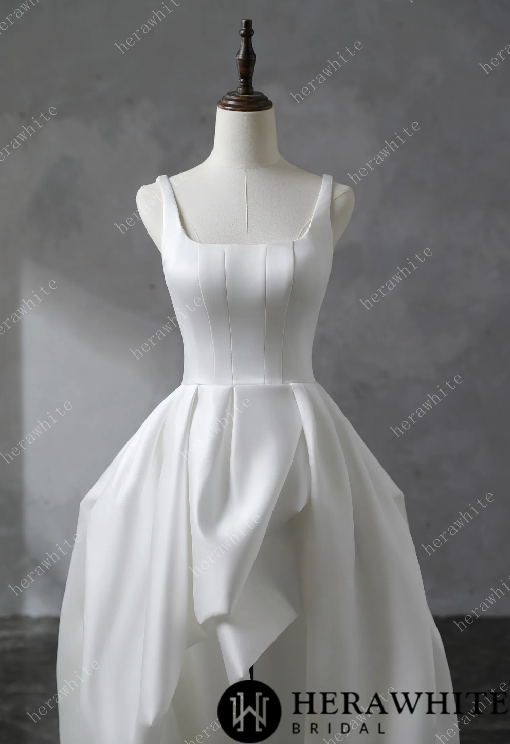 Wedding Dress Draped Satin Bridal Gown with Train, and straps and a deep U neckline, it highlights the décolletage gracefully. The skirt’s rectangular pattern, gathered at the waist,
