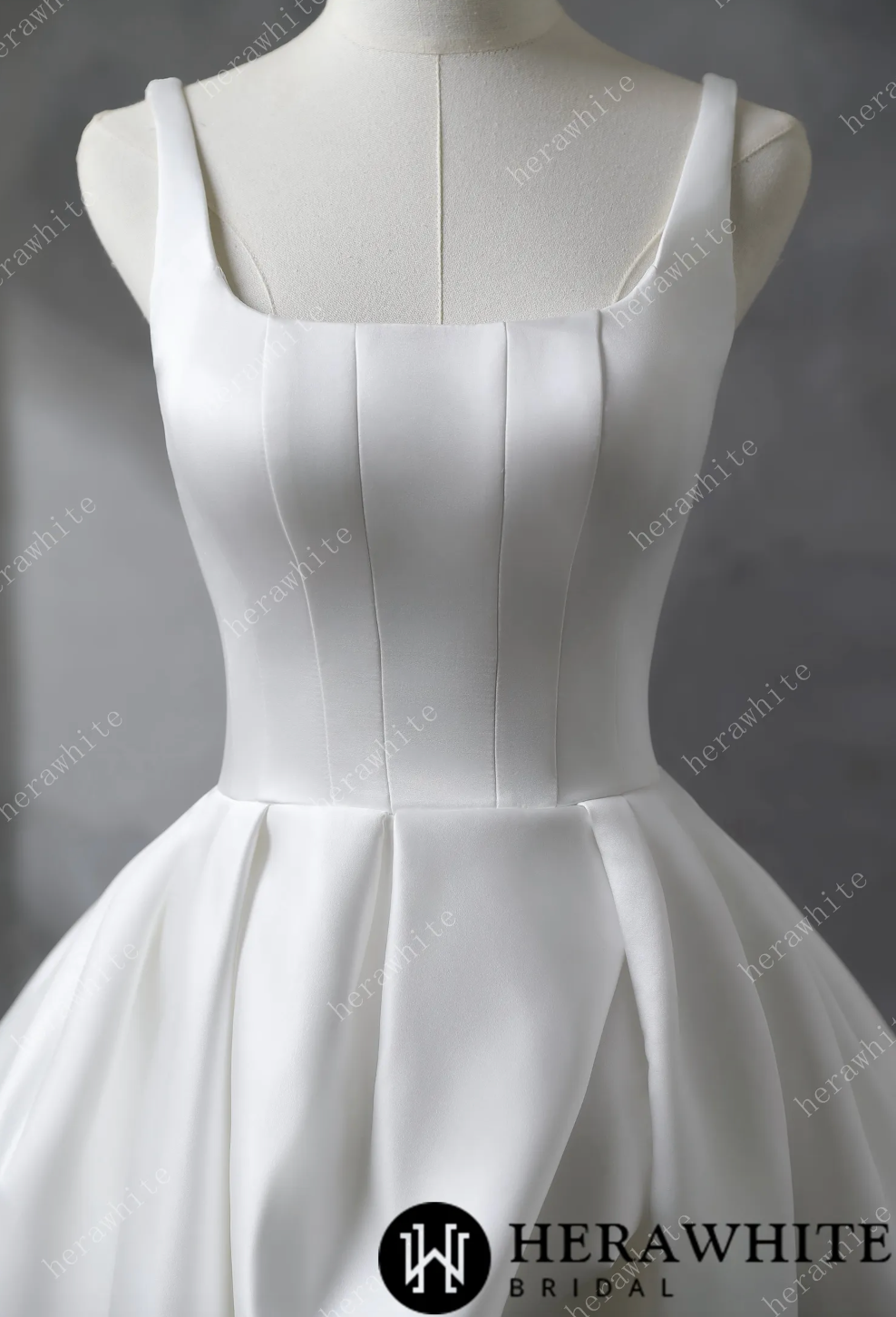 Wedding Dress Draped Satin Bridal Gown with Train, and straps and a deep U neckline, it highlights the décolletage gracefully. The skirt’s rectangular pattern, gathered at the waist,