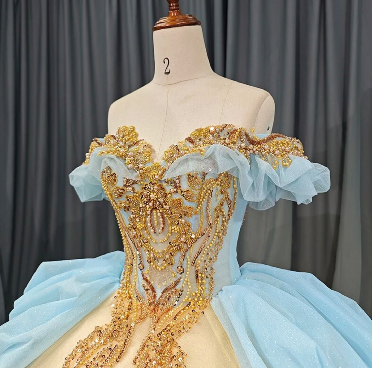 Quinceanera Dress Blue Gold Organza Ball Gown With Train, This unique Quinceanera dress is crafted with luxurious details; a soft, ethereal baby blue hue i
