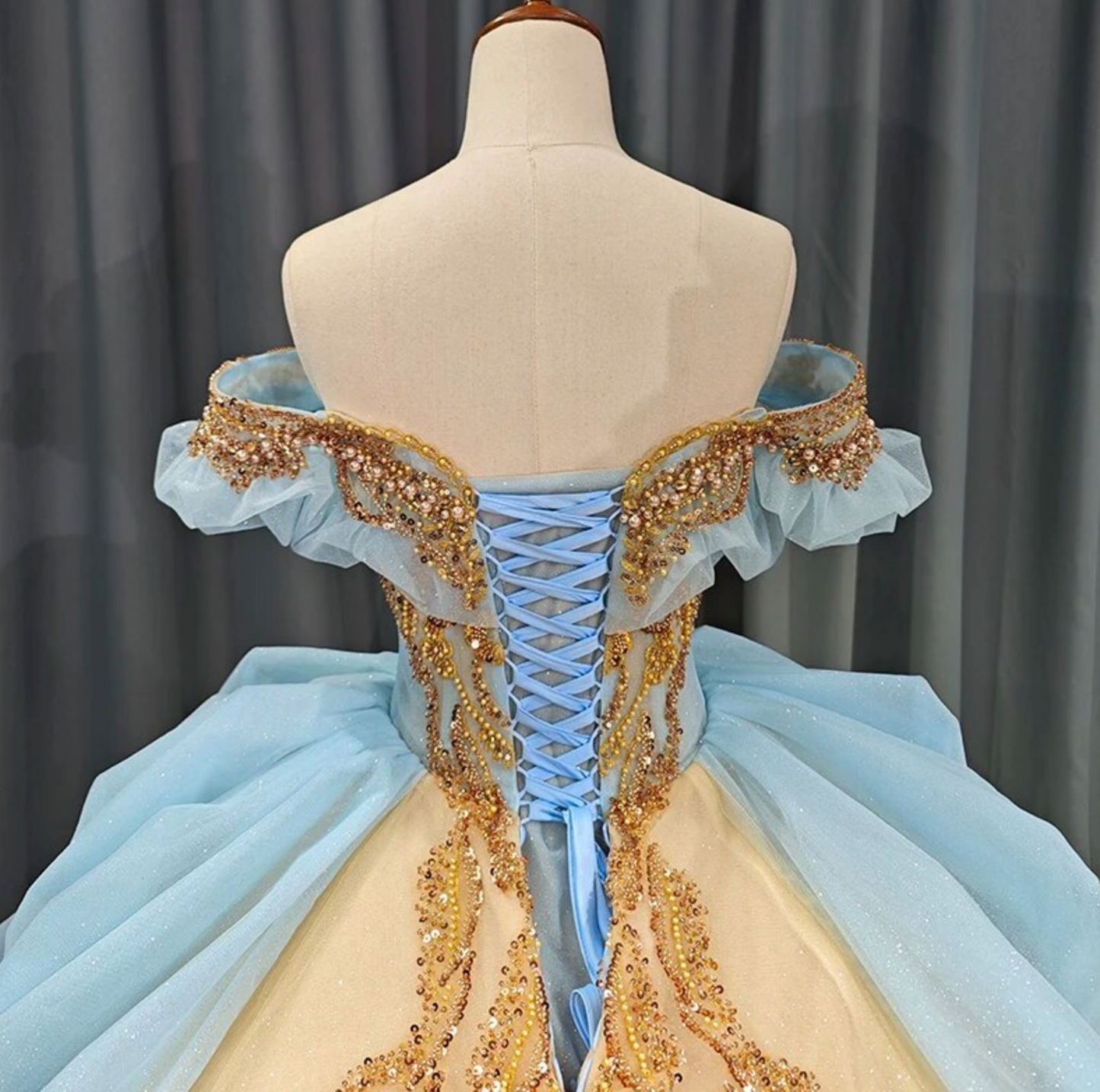 Quinceanera Dress Blue Gold Organza Ball Gown With Train, This unique Quinceanera dress is crafted with luxurious details; a soft, ethereal baby blue hue i