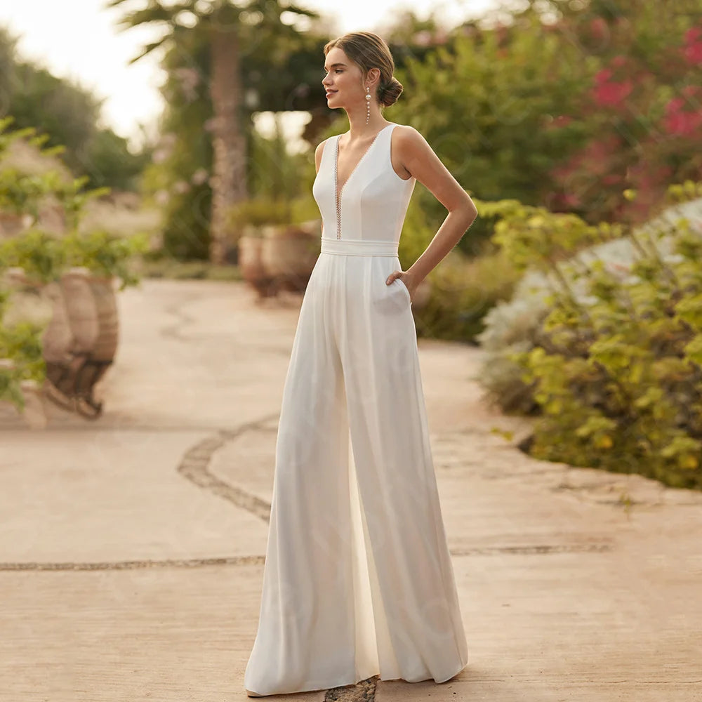 Wedding Jumpsuit With Removable Chiffon Train,  Elevate your bridal look with our White Two Pieces Wedding V Neckline Pant Suit. This modern boho jumpsuit features a deep V