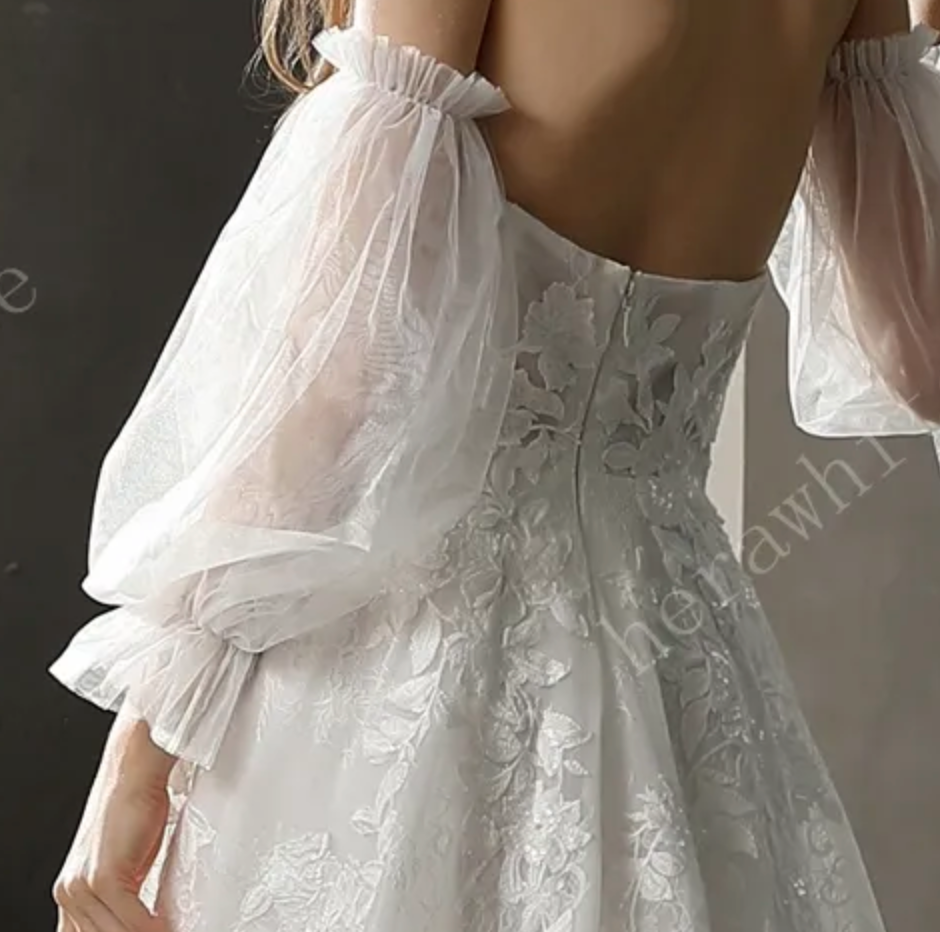 Floral Lace Wedding Dress Detachable Puff Sleeves A Line Bridal Gown,  turn heads in this soft luxe bridal look. A strapless sweetheart neckline features a dramati