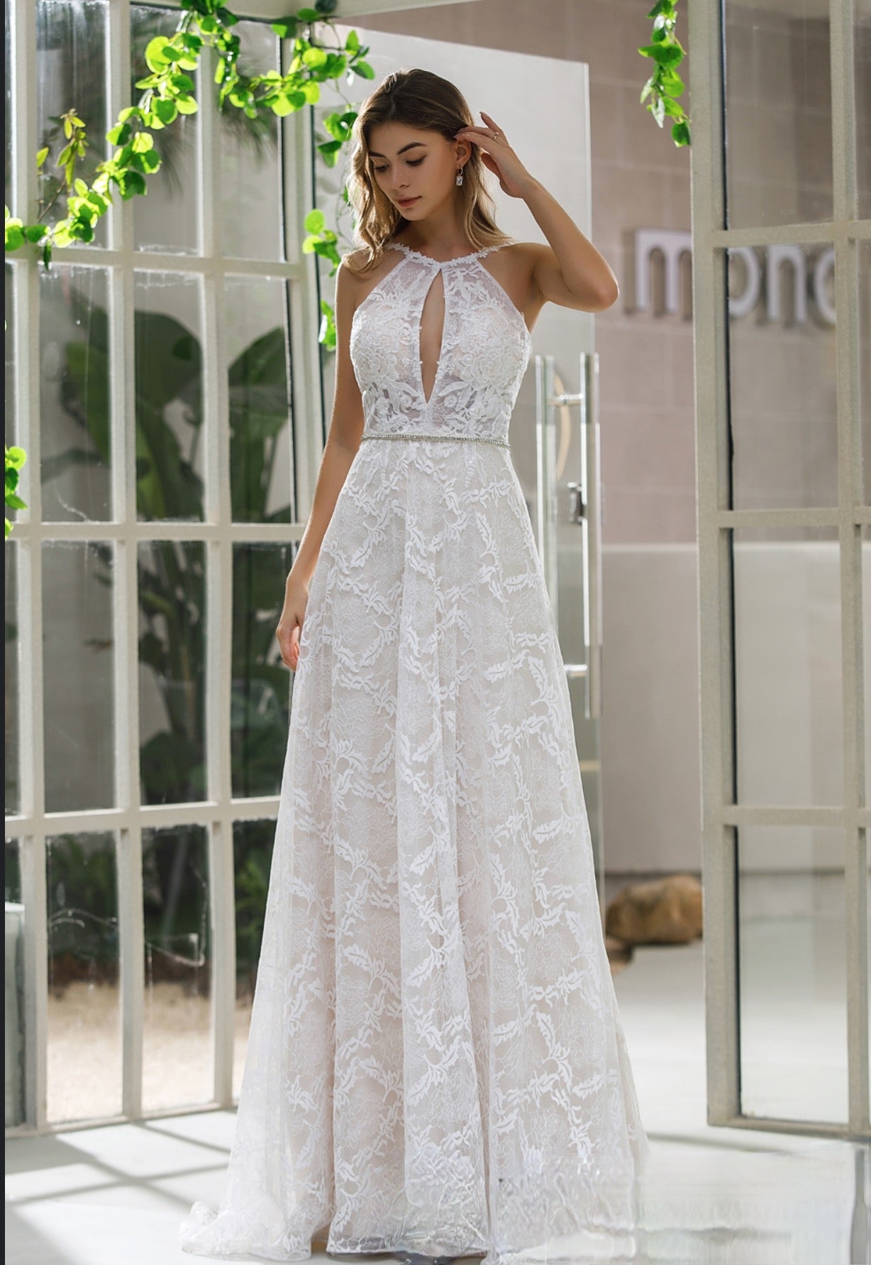 Wedding Dress Halter Neckline Lace Crisscross Back Gown, A sophisticated halter neck gown with a sensual front split, floral lace adorns the neck.
