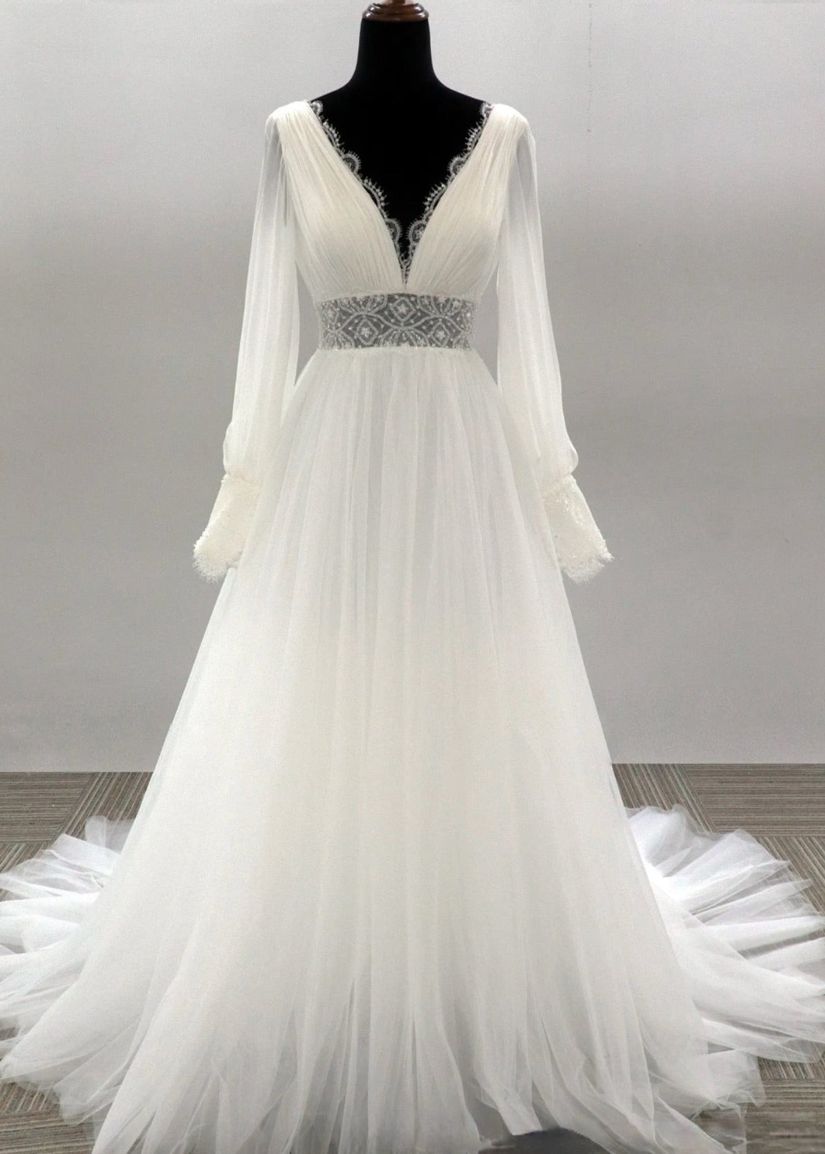 Swiss Tulle Wedding Dress Satin A Line Bridal Gown, this beautiful A-line wedding dress features a plunging V-neckline and low V back with scalloped trim.