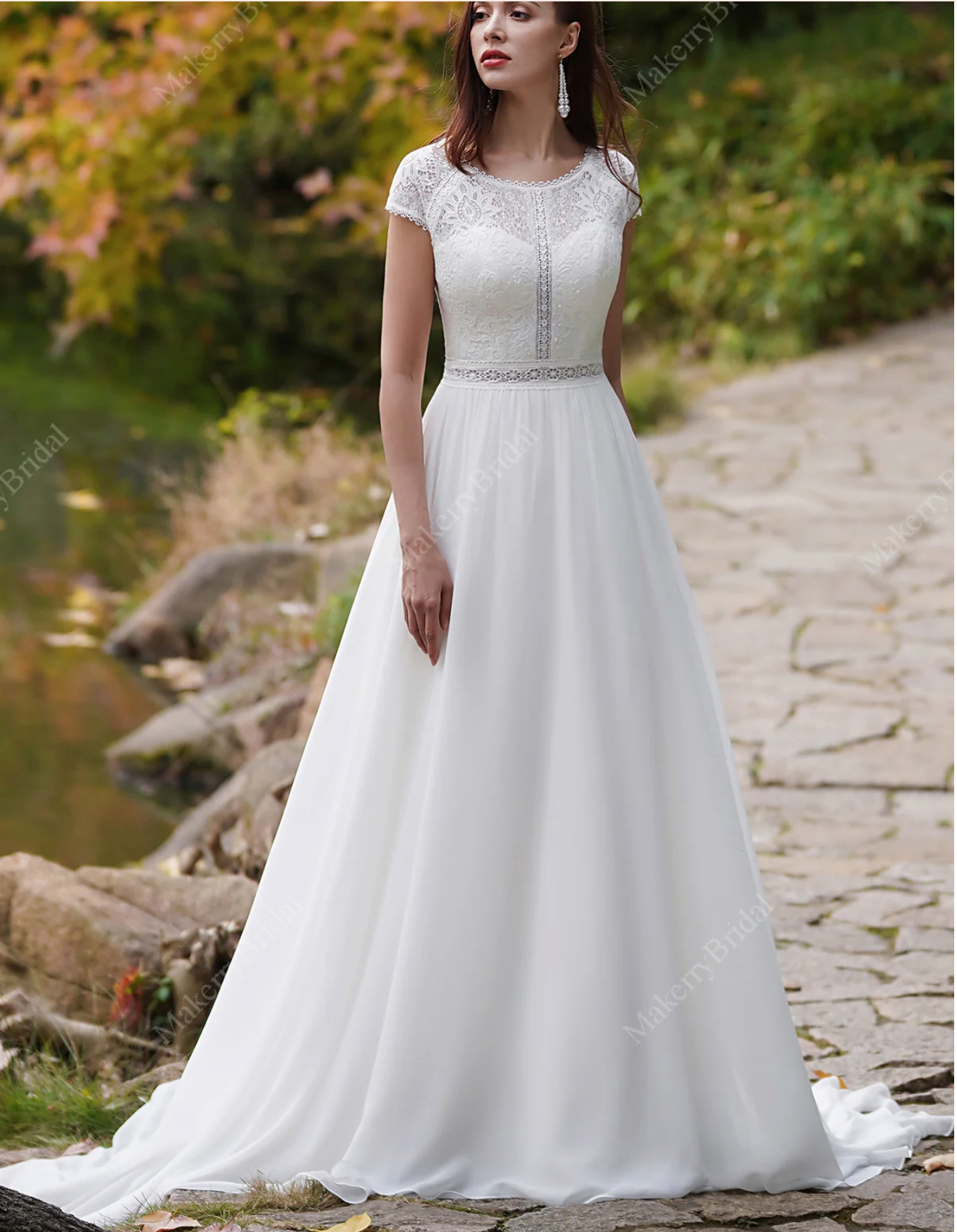 Elegant chiffon bohemian wedding dress with cap sleeves and lace detailing, perfect for a special occasion.