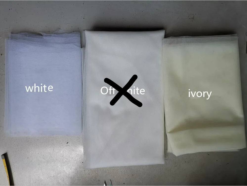 
                      
                        Three fabric samples labeled 'white', 'off white', and 'ivory' on a gray surface.
                      
                    