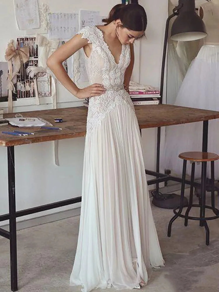 
                      
                        woman in a white boho lace a line wedding dress
                      
                    
