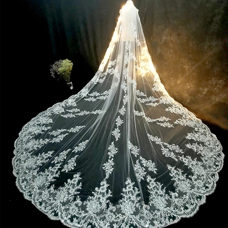 Lace wedding veil with intricate designs on a dark background