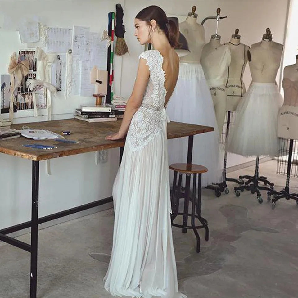 
                      
                        woman in a white boho lace a line wedding dress
                      
                    