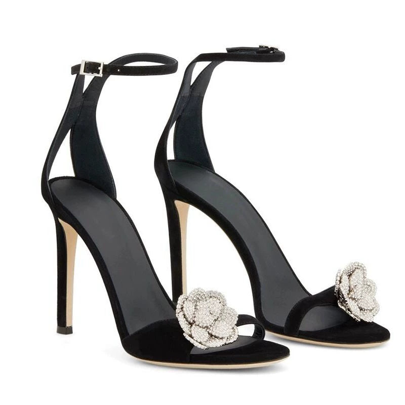 Black high-heeled shoes with floral embellishments crystal flower