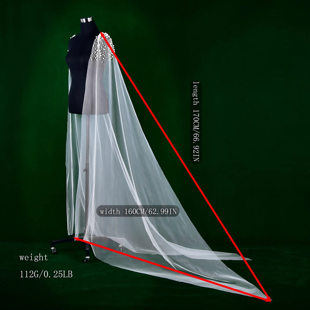 
                      
                        White bridal veil on a mannequin with measurements indicated on a green background
                      
                    