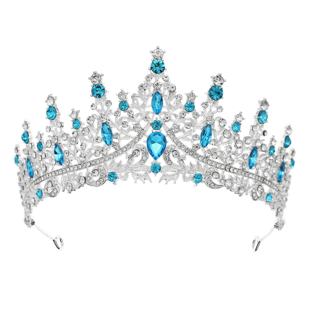 
                      
                        Elegant tiara with blue gemstones on a white background
                      
                    