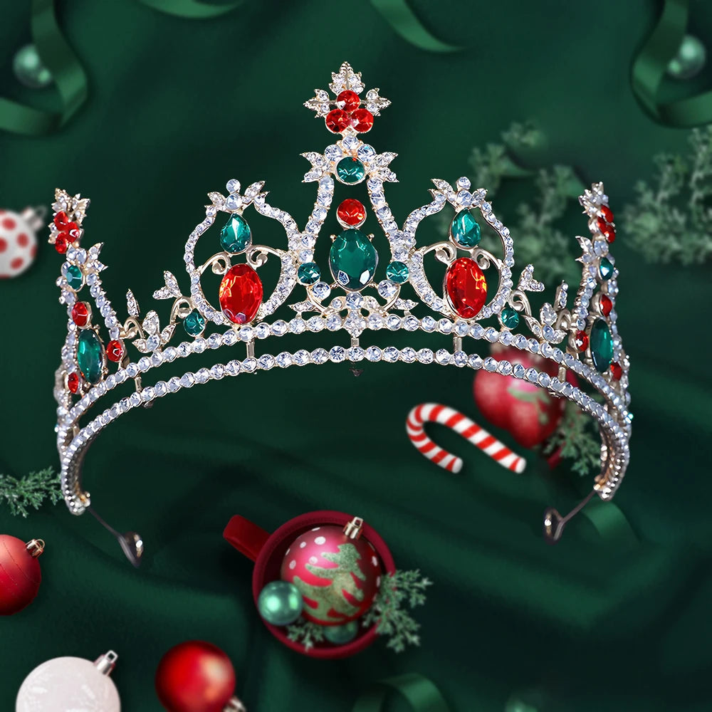 
                      
                        Decorative tiara with red and green gemstones on a festive background with ornaments.
                      
                    