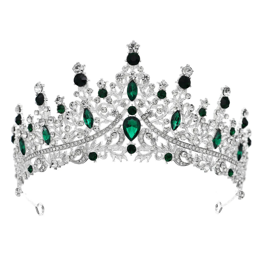
                      
                        Elegant tiara with green gemstones on a white background
                      
                    