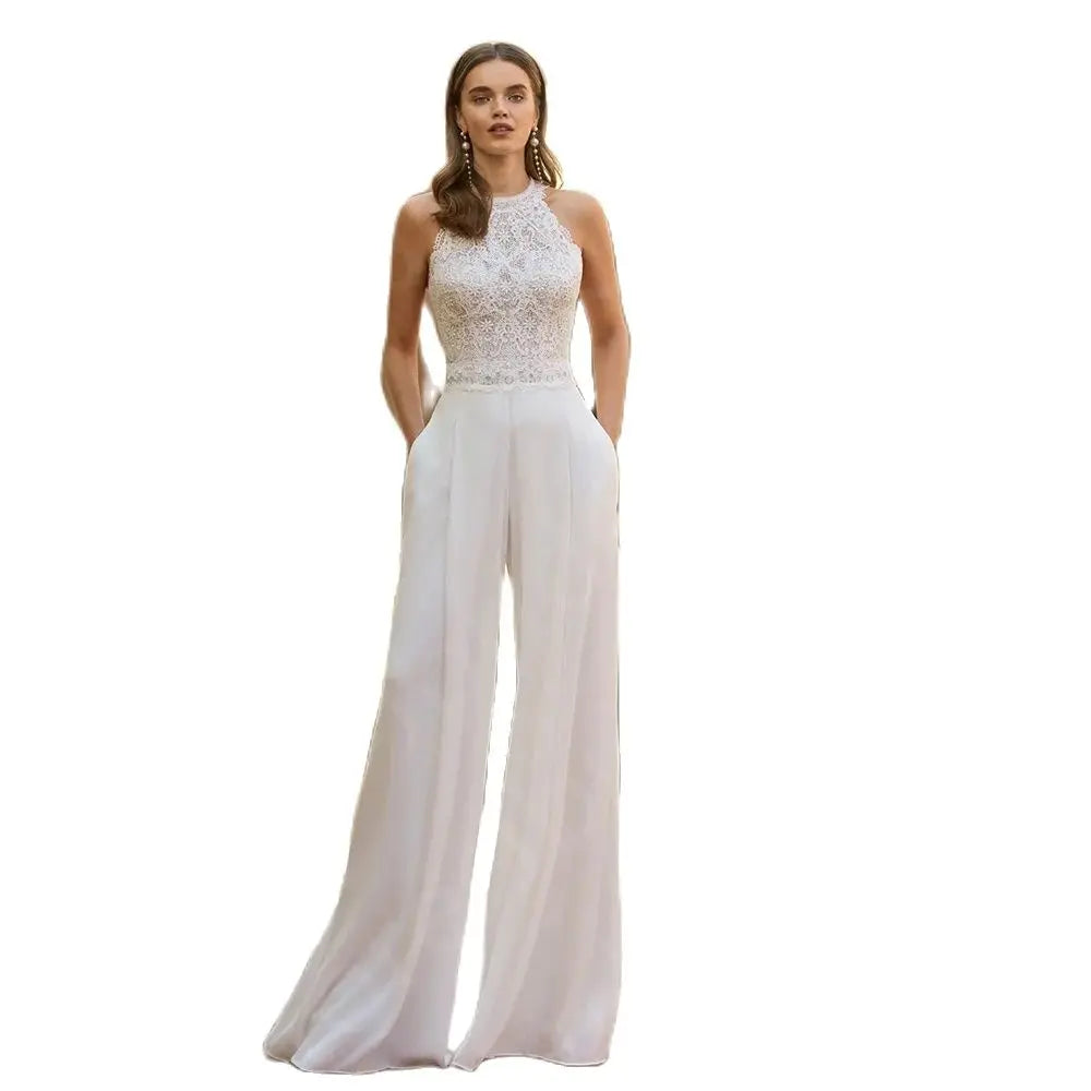 Woman wearing a bridal white lace halter top and wide-leg pants on a white background wedding jumpsuit