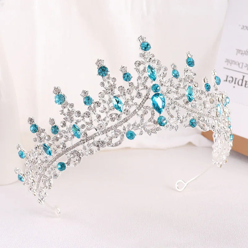 Decorative tiara with blue stones on a light background