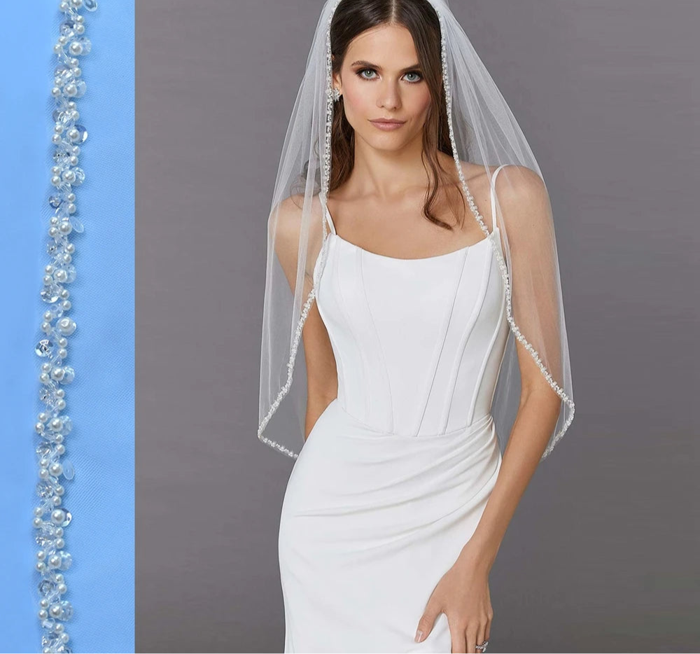woman wearing a bridal veil with beaded edge