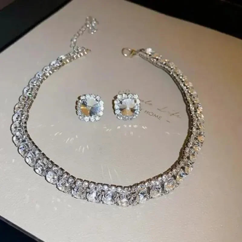 
                      
                        Crystal Jewelry set with necklace and earrings on a light background
                      
                    