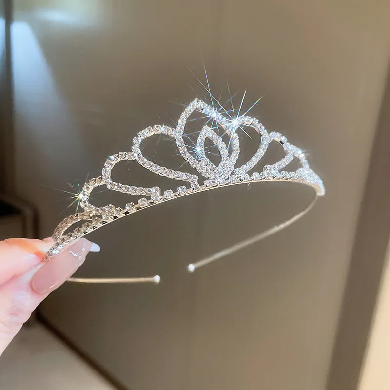 
                      
                        Girls princess tiara crowns in a variety of styles, crystal tiaras on metal frame, pageant, prom, party events.
                      
                    