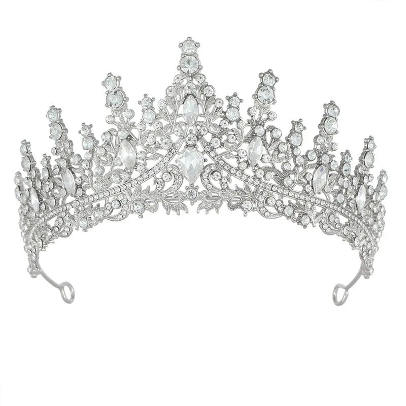
                      
                        Silver tiara with clear stones on a white background
                      
                    