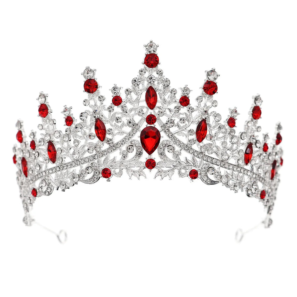 
                      
                        Elegant tiara with red gemstones on a white background
                      
                    