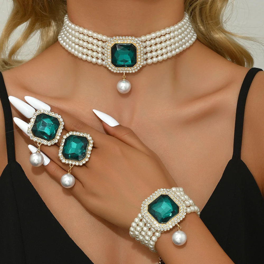 Pearl and emerald green gemstone jewelry set on a model