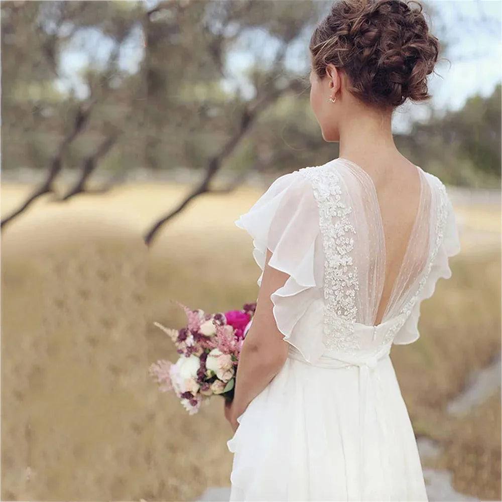 
                      
                        Boho Ruffle V-Neck Wedding Dress Chiffon A Line Short Sleeve Backless Beach Bridal Gown
                      
                    