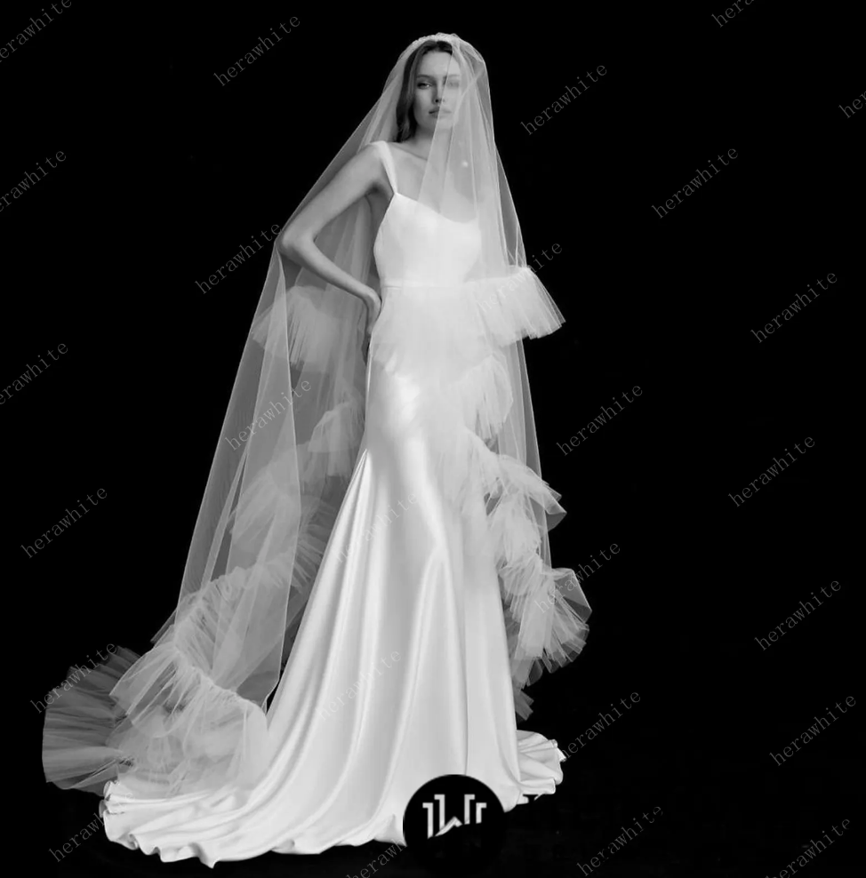 
                      
                        Two Tiered Cathedral Ruffle Veil Match to Your Hera White Gown
                      
                    