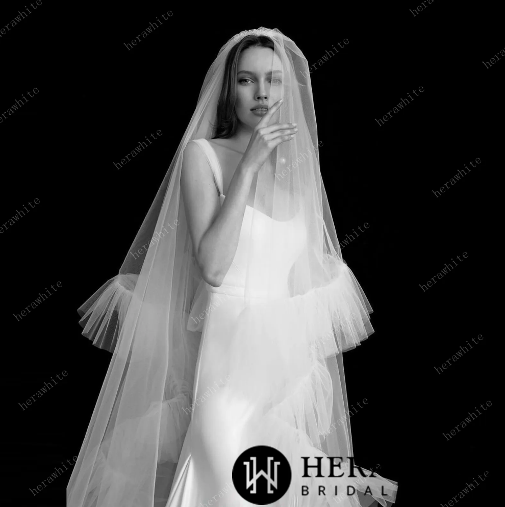 
                      
                        Two Tiered Cathedral Ruffle Veil Match to Your Hera White Gown
                      
                    