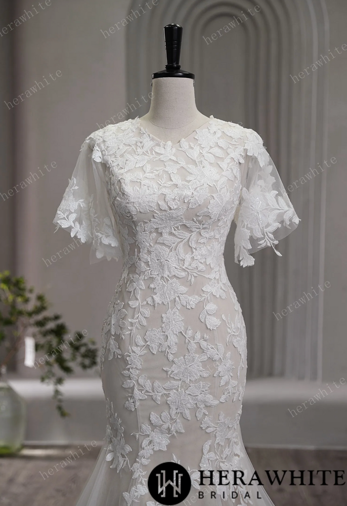 
                      
                        High Neck Floral Lace Bridal Gown with Flutter Sleeves
                      
                    