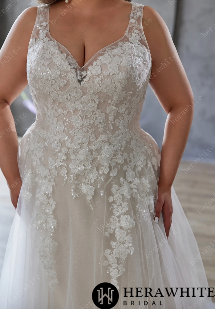 
                      
                        Elegant and Ethereal Plus-Size Wedding Dress with Lace and Sequins
                      
                    
