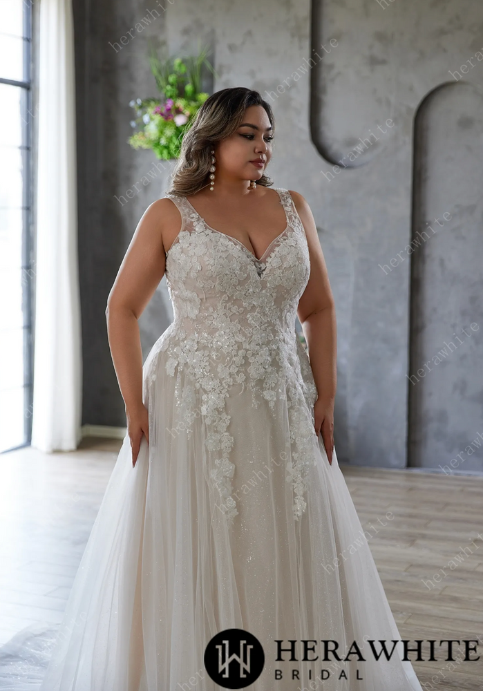 
                      
                        Elegant and Ethereal Plus-Size Wedding Dress with Lace and Sequins
                      
                    