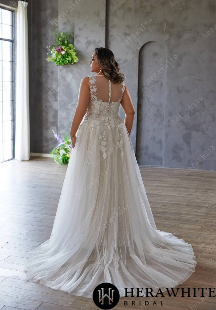 
                      
                        Elegant and Ethereal Plus-Size Wedding Dress with Lace and Sequins
                      
                    