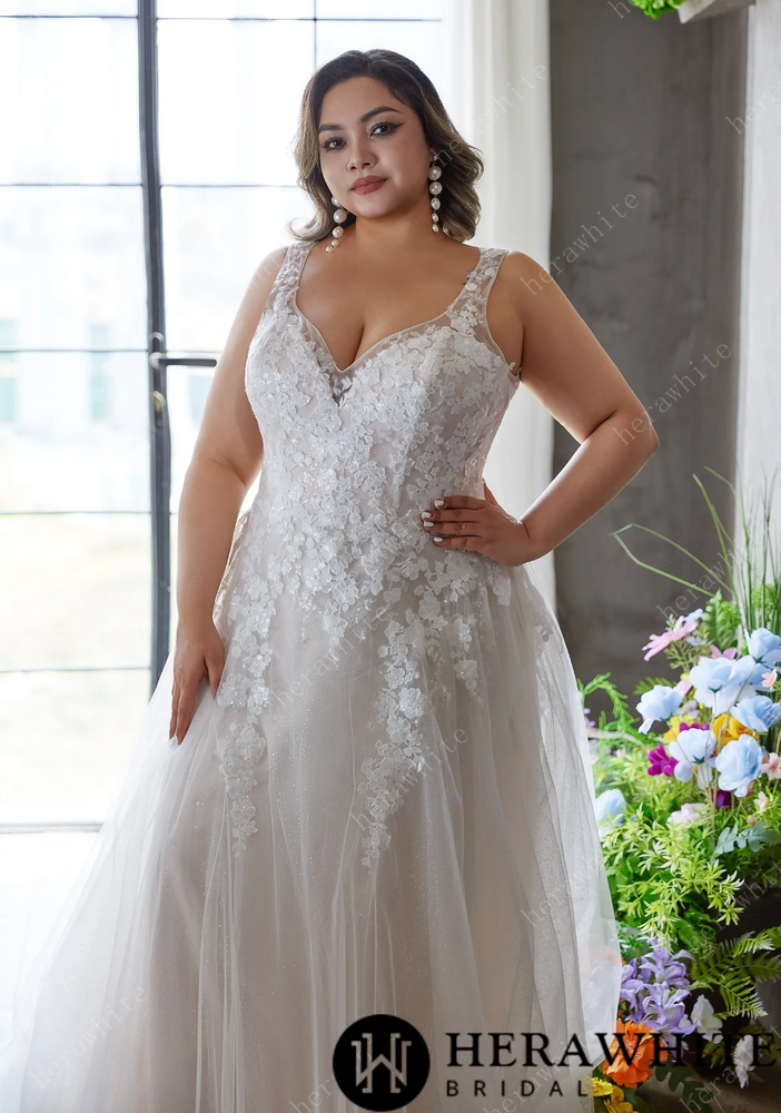 
                      
                        Elegant and Ethereal Plus-Size Wedding Dress with Lace and Sequins
                      
                    