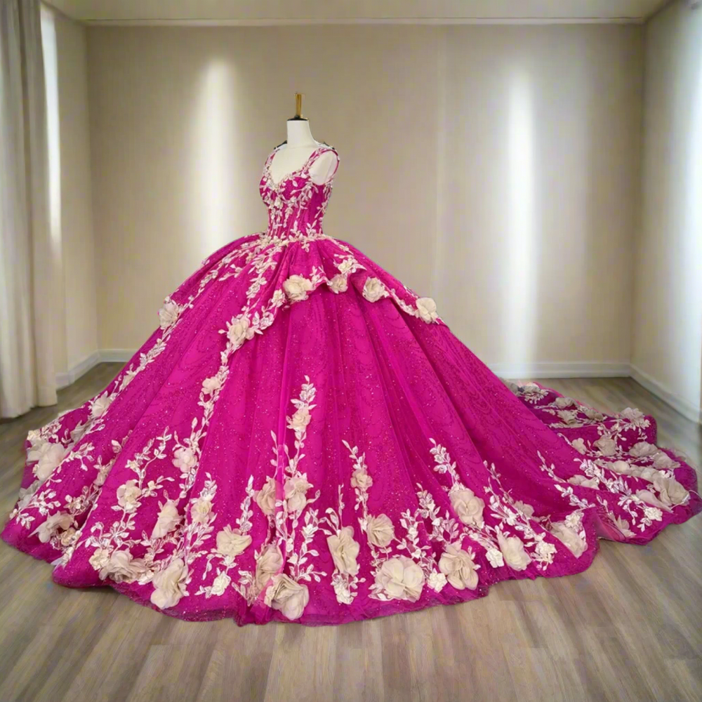 
                      
                        Pink gown with floral embroidery on a mannequin
                      
                    