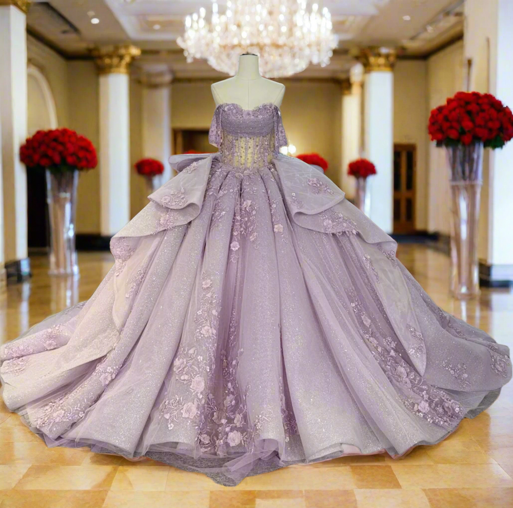Elegant purple gown on a mannequin in a room 