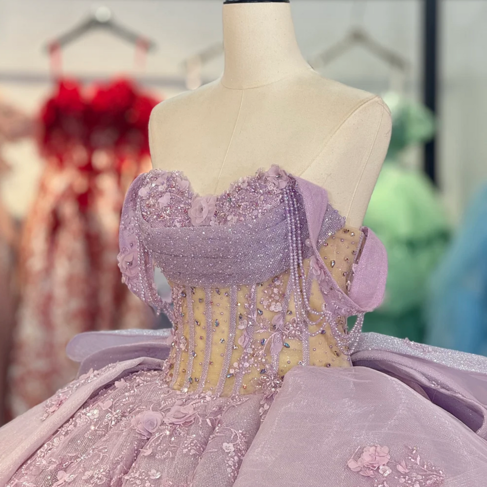 
                      
                        Elegant purple gown on a mannequin in a room 
                      
                    