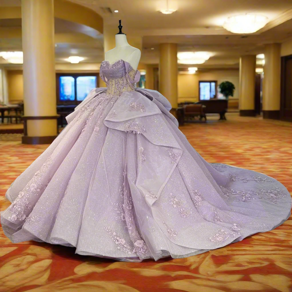 
                      
                        Elegant purple gown on a mannequin in a room 
                      
                    