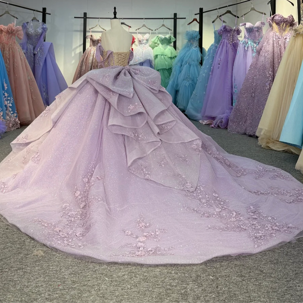 
                      
                        Elegant purple gown on a mannequin in a room 
                      
                    