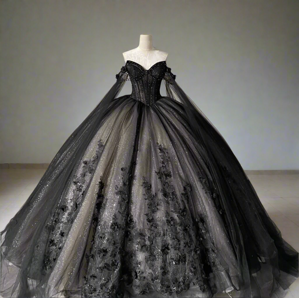 Black evening gown on a mannequin against a gray tiled wall