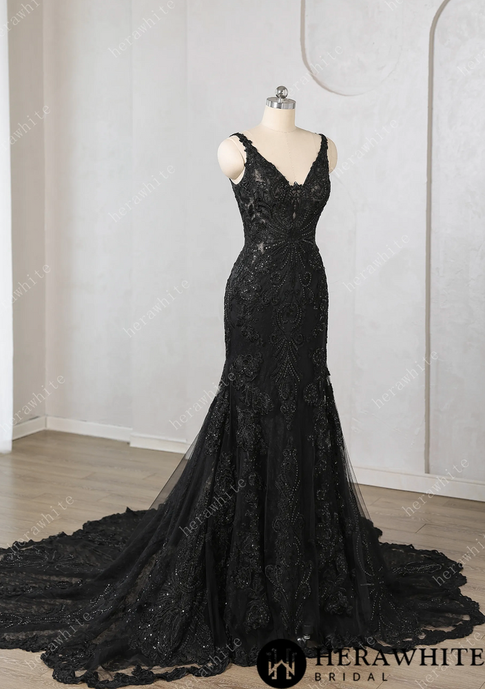 
                      
                        Black lace evening gown on a mannequin against a neutral background


                      
                    