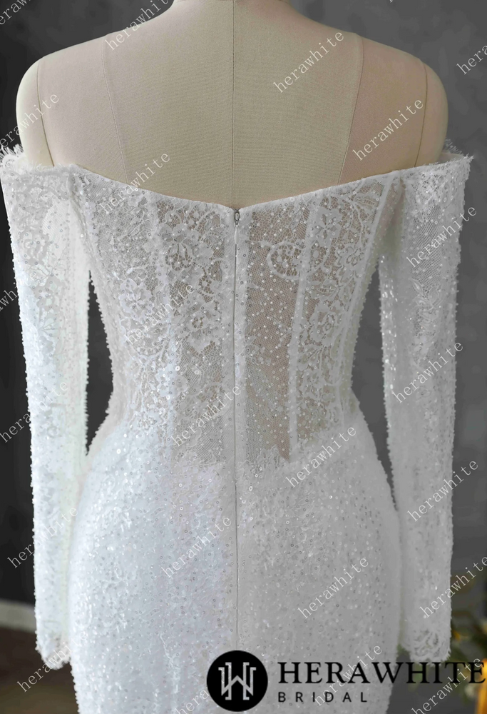 
                      
                        White lace wedding dress on a mannequin
                      
                    